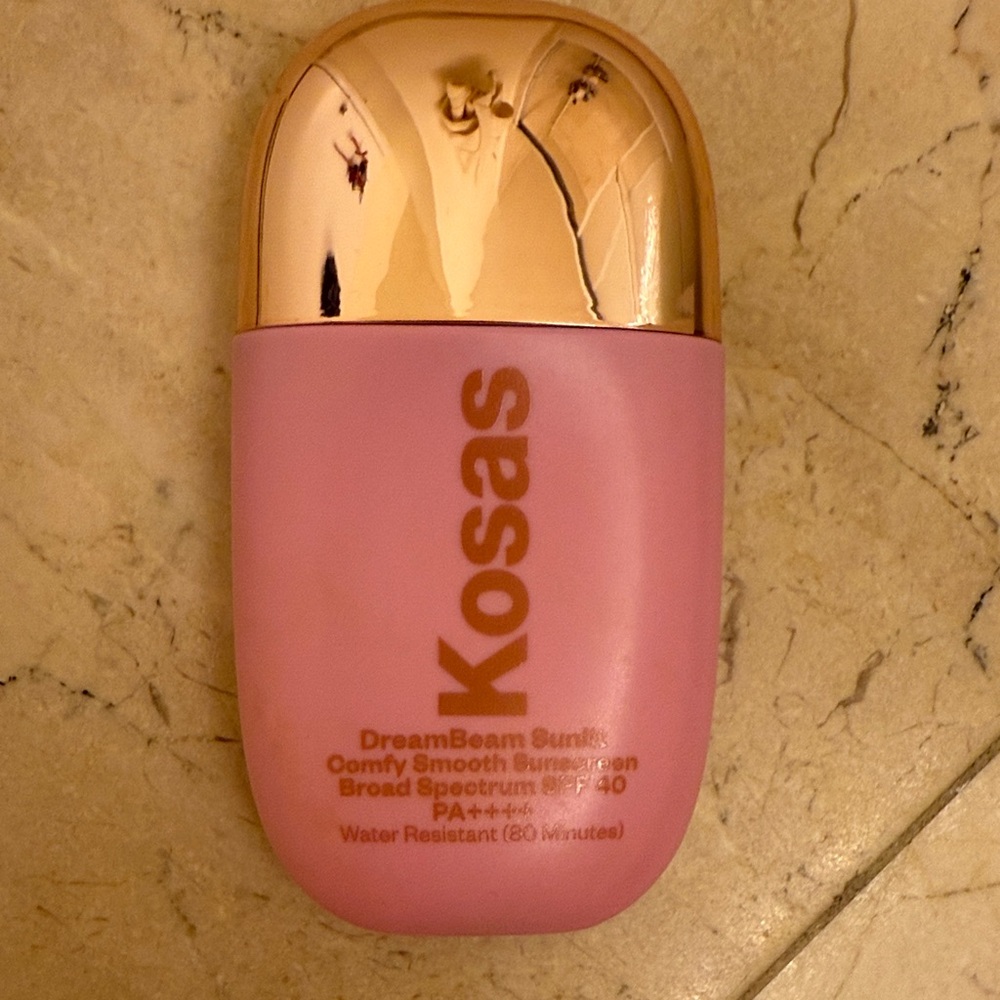 Kosas DreamBeam Sunscreen in Pink with Gold Cap